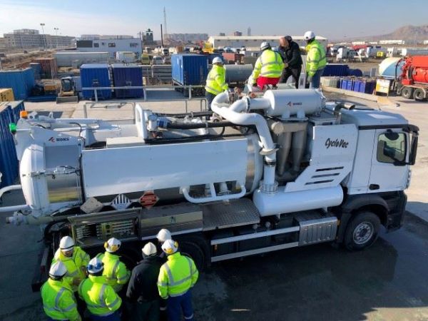 KOKS Academy instruction on top of a KOKS CycloVac vacuum truck